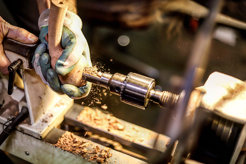 Adam Davidson shaping a tobacco pipe