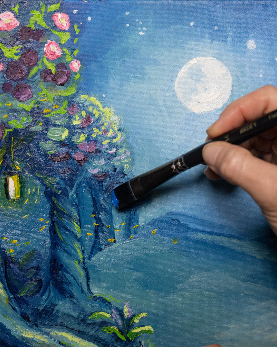 Ania painting the Midnight Orchard art | Daily Reader